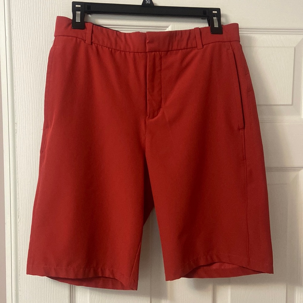 Red Nike golf shorts with sticky band inside